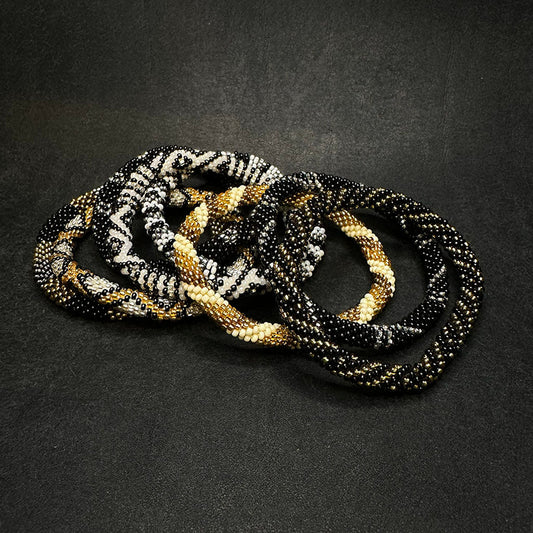 A pile of bracelets from this collection.