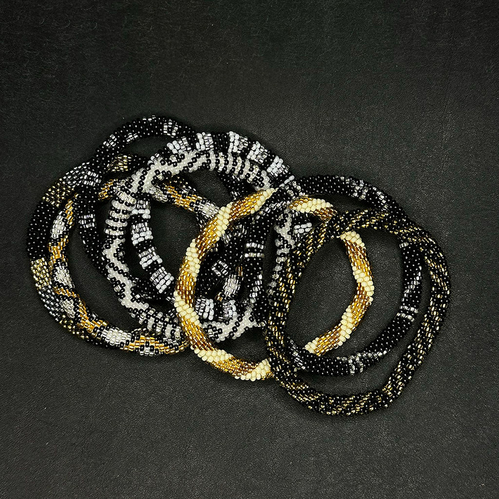 A pile of bracelets from this collection.